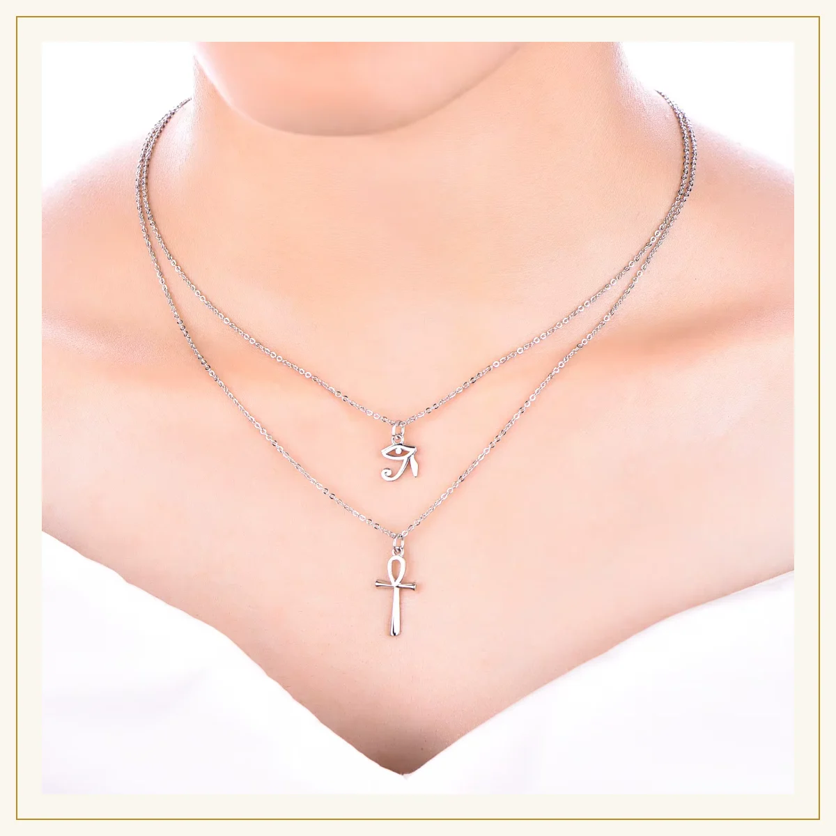 Layered ankh and Eye of Horus necklace worn on the neck